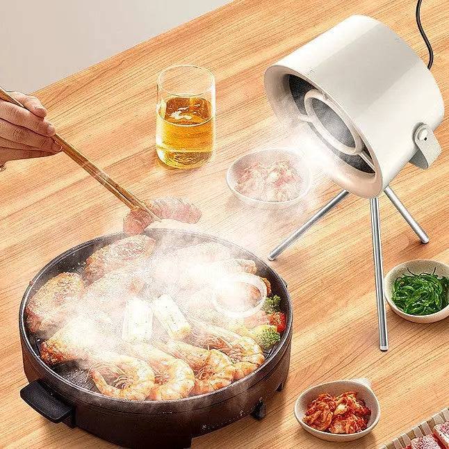 Small kitchen hood extractor efficiently removes cooking fumes