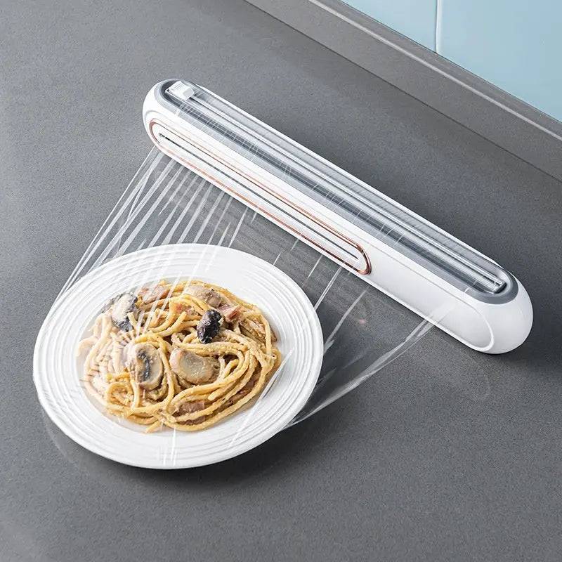 Magnetic Plastic Wrap Cutter mounted on refrigerator for easy access  