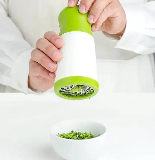 Ergonomic kitchen grinder featuring a durable stainless steel herb chopper  