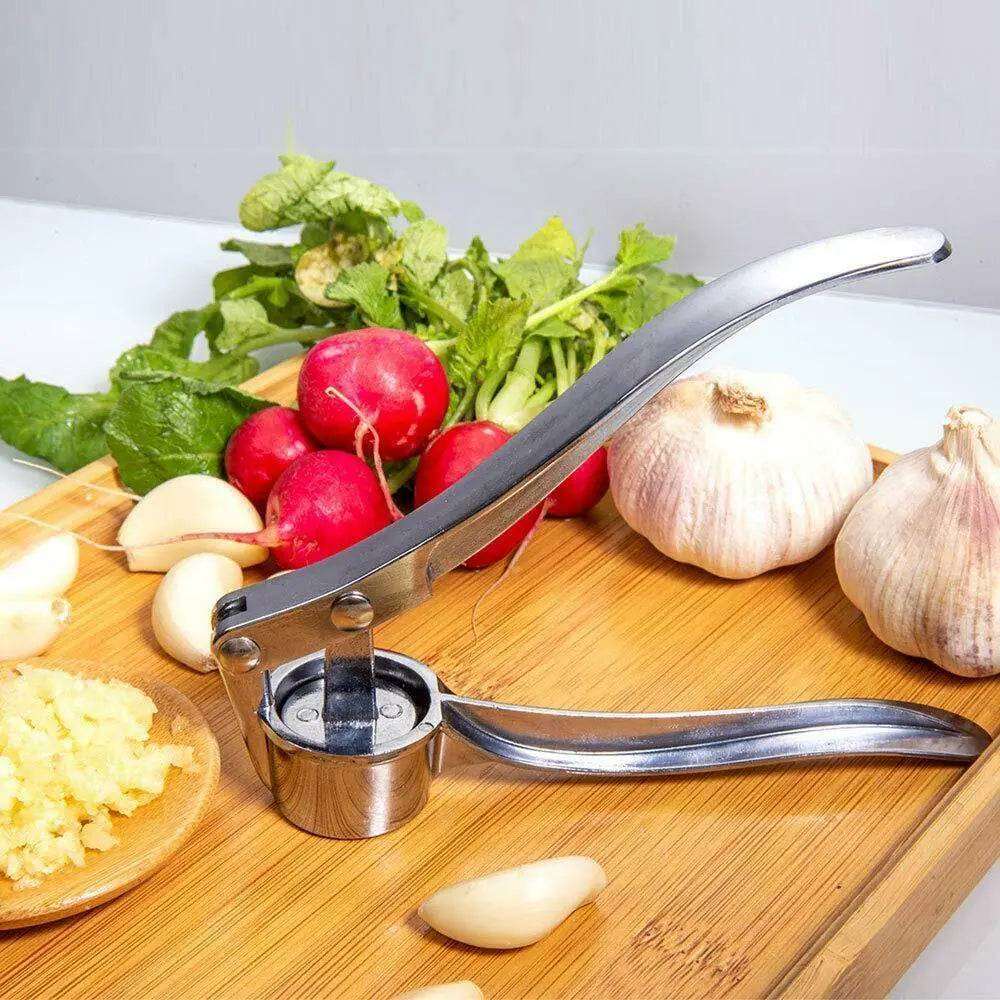 Time-saving garlic cutter positioned alongside kitchen gadgets and tools