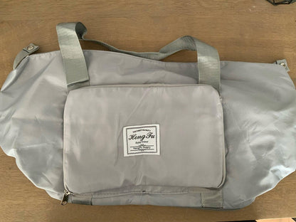 Multi-compartment shoulder bag for efficient storage  